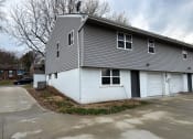 Thumbnail 22 of 26 - a white and gray house with a white garage