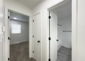 Thumbnail 5 of 26 - a bedroom with a closet and a door to a bathroom