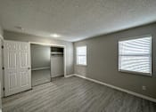 Thumbnail 6 of 8 - an empty living room with a large window