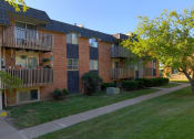 Thumbnail 3 of 17 - The exterior of brick and balcony at Lexington Square in Independence, MO