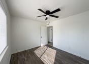 Thumbnail 6 of 15 - the living room of our studio apartment atrium with a ceiling fan