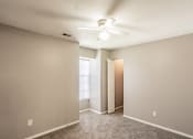 Thumbnail 16 of 23 - Bedroom with window and ceiling fan