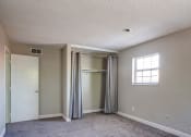 Thumbnail 10 of 16 - an empty room with a closet and a window