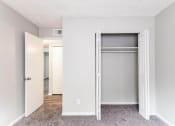 Thumbnail 11 of 15 - an empty bedroom with an open closet door