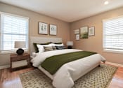 Thumbnail 12 of 25 - A bedroom with a large bed and a green blanket.