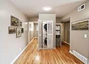 Thumbnail 9 of 25 - A hallway with a washer and dryer in it.