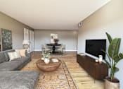 Thumbnail 4 of 25 - A living room with a grey couch, a coffee table, a TV, and a plant.