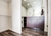 Thumbnail 22 of 25 - A laundry room with a washer and dryer.