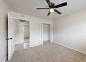 Thumbnail 8 of 14 - an empty living room with a ceiling fan