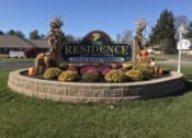 Thumbnail 1 of 21 - a sign for the residence is in the middle of a yard