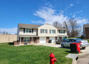 Thumbnail 24 of 26 - exterior of duplex with garage