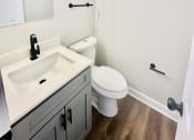 Thumbnail 36 of 39 - an empty bathroom with a sink and a toilet