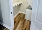 Thumbnail 38 of 39 - a room with a closet and a washer and dryer in it