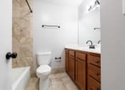 Thumbnail 30 of 39 - a bathroom with a toilet sink and bathtub