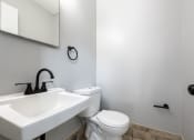 Thumbnail 37 of 39 - a bathroom with a sink toilet and mirror