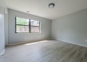 Thumbnail 34 of 39 - an empty bedroom with a large window