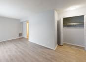 Thumbnail 13 of 39 - an empty bedroom with a closet and an open door