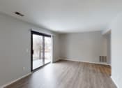Thumbnail 17 of 39 - a bedroom with hardwood floors and grey walls