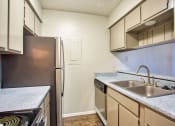 Thumbnail 10 of 28 - a kitchen with a sink and a refrigerator