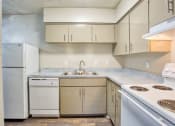 Thumbnail 11 of 28 - a kitchen with white appliances and white cabinets