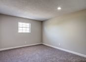 Thumbnail 7 of 16 - an empty room with white walls and a window