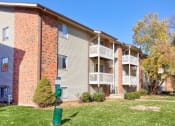Thumbnail 4 of 12 - Exterior of building with private patios and balconies