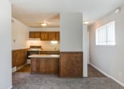 Thumbnail 7 of 12 - View of dining room and  kitchen with sink, stove, refrigerator, and cabinets
