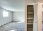 Thumbnail 9 of 12 - View of living room and linen closet