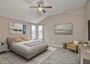 Thumbnail 5 of 14 - a bedroom with a bed and a ceiling fan