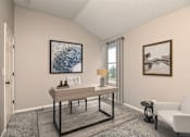 Thumbnail 6 of 14 - a living room with a desk and a window