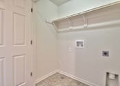 Thumbnail 11 of 14 - an empty room with a white wall and a white door