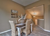 Thumbnail 15 of 25 - a dining room with a table and chairs