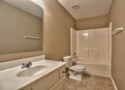 Thumbnail 25 of 25 - a bathroom with a sink toilet and a shower