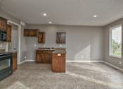 Thumbnail 14 of 14 - an empty kitchen with an island in the middle of it