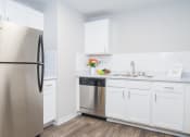 Thumbnail 4 of 18 - The Lighthouse Model Kitchen with Stainless Appliances