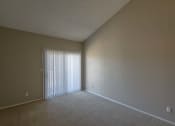 Thumbnail 8 of 36 - an empty living room with a window and