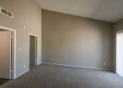 Thumbnail 9 of 36 - an empty living room with a door to a closet