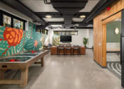 Thumbnail 8 of 19 - The Hemlock Apartments in Seattle, Washington Clubhouse Lounge with Games and TV at The Hemlock, Seattle