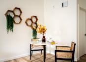 Thumbnail 10 of 30 - The Wes Gresham Oregon Apartments Dining area with two chairs and dining table