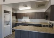 Thumbnail 10 of 36 - a kitchen with a counter top and a sink