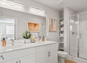 Thumbnail 26 of 58 - a bathroom with a sink and a shower and a toilet