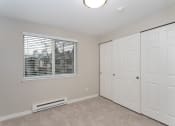 Thumbnail 28 of 39 - Novela Apartments Bedroom with Window and Closet Doors