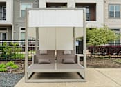 Thumbnail 24 of 33 - A white canopy is over a grey couch.