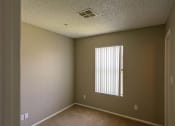 Thumbnail 18 of 36 - an empty room with a window in it