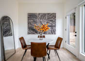 Thumbnail 19 of 30 - The Wes Gresham Oregon Apartments A dining room with a round table and chairs.