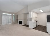 Thumbnail 39 of 39 - Novela Apartments Kitchen and Living Space with Fireplace