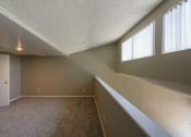 Thumbnail 22 of 36 - a large empty room with windows and a ceiling