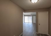 Thumbnail 24 of 36 - the living room and dining room of an empty house