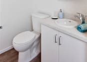 Thumbnail 32 of 33 - a bathroom with a toilet sink and mirror