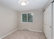 Thumbnail 29 of 39 - Novela Apartments Bedroom with Closet Door and Window